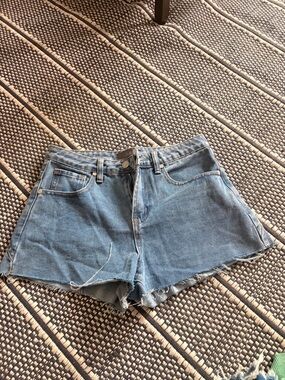 High-Rise Light Blue Denim Cutoff Shorts with Frayed Hem